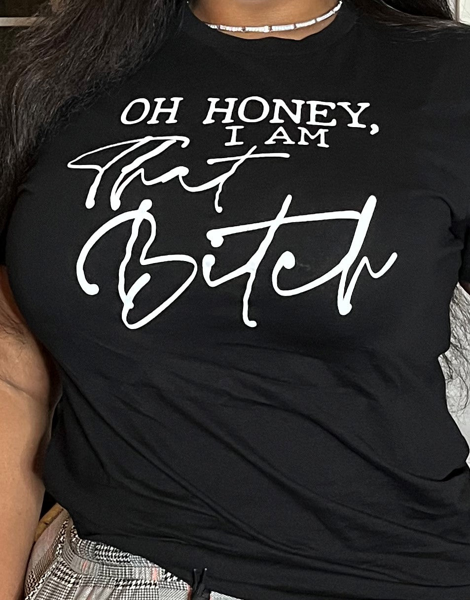 Closeup of woman wearing tee shirt that reads "Oh honey, I am that bitch"