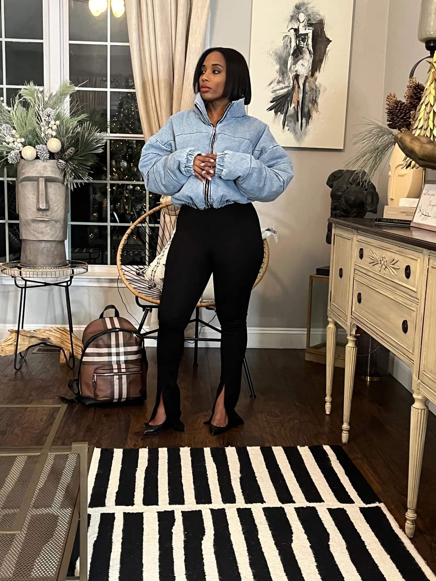 Woman in puffed jacket and elegant black pants